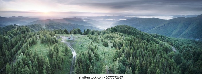 Autumn in the Carpathians, Ukraine. Beech and coniferous forests are picturesque and colorful, oil bases and hydrocarbon pumps are ready for winter, helicopter bird's eye view - Shutterstock ID 2077072687