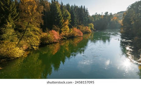 Autumn colorful forest by river Brda at sunrise in Poland, Europe. Aerial view of nature. - Powered by Shutterstock