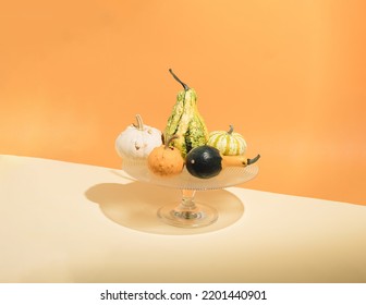 Autumn Colorful Pumpkins On Stand For Wedding,birthday,cakes, Sweets,pastries, Cupcakes, And Other On Orange Background. Harvest Or Halloween Concept. Modern Aesthetic. Minimal Seasonal Creative Conc