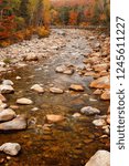 Autumn colors surround a rocky brook