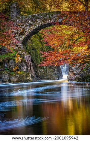 The autumn colours on Black Linn Falls at the Hermitage on the River Braan near Dunkeld in Perthshire