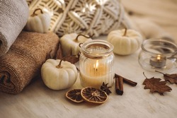 Autumn Composition With Aromatic Candle, Dry Citrus, Cinnamon, Anise. Aromatherapy On A Grey Fall Morning, Atmosphere Of Cosiness And Relax. Wooden Background, Pumpkin As Decor