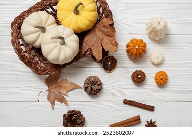 Autumn composition with candles, pumpkins and pine cones on light wooden background - Powered by Shutterstock