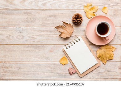 Autumn composition: fallen leaves and craft sketchbook mock up on colored background. Top view. Flat lay with copy space. - Shutterstock ID 2174935109