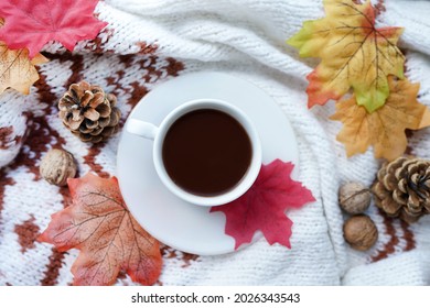 Autumn Composition With Hot Cup Of Coffee With Scarf, Nuts And Leaves. Concept Of Cozy Morning, Comfort, Relax, Melancholy, Fall Weather, Home.