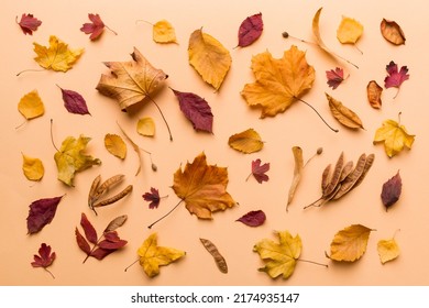 Autumn composition. Pattern made of dried leaves and other design accessories on table. Flat lay, top view. - Shutterstock ID 2174935147