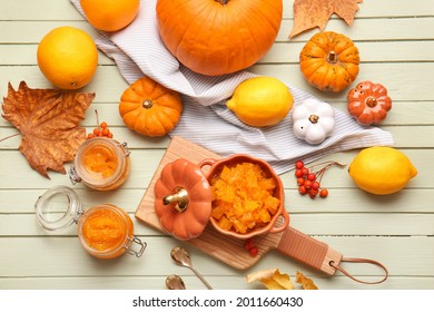 Autumn composition with tasty pumpkin jam on wooden background - Shutterstock ID 2011660430