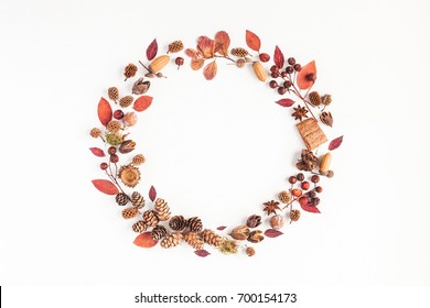 Autumn composition. Wreath made of autumn leaves, pine cones, anise star. Flat lay, top view, copy space. - Powered by Shutterstock
