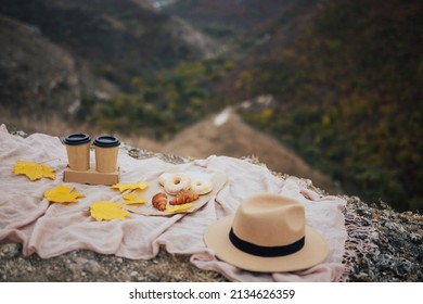 Autumn Cozy Picnic In The Mountain With  Coffee And Donuts.