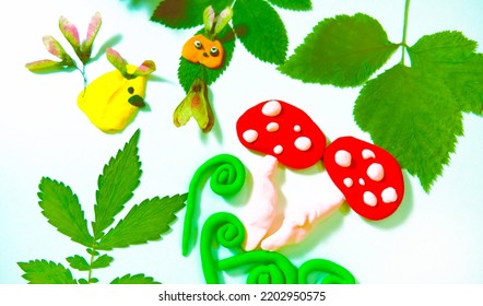 Autumn Crafts. Child Making Crafts From Natural Dry Plants, Flowers, Grass And Leaves Use  Plasticine. Back To School, Natural History. Ideas For Children's Art