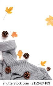 Autumn Creative Composition. Maple Leaves, Cones, Cozy Sweater On White Studio Background Wall With Copy Space For Promotion Content. Fall, Thanksgiving Day Concept. Flat Lay, Top View