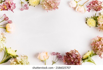 Autumn creative composition roses, hydrangea flowers on gray background. Fall, autumn background. Flat lay, top view, copy space - Shutterstock ID 2186025707