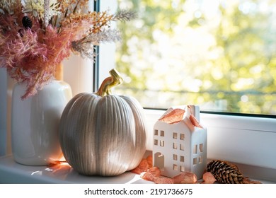 Autumn Decor On A Window, Dried Flowers, Pumpkin And Toy House, Sweet Home. Still Life Details In Home On A Wooden Window