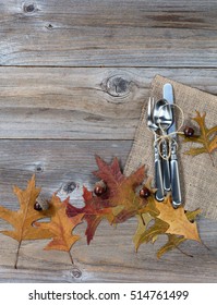 Autumn Dinner Place Setting For Thanksgiving Holiday In Vertical Layout On Rustic Wooden Boards. 