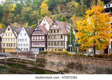 Autumn embankment of Nagold river in Calw, old German city landscape