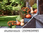 Autumn entryway decor, staircase decor with pumpkins and fall flowers