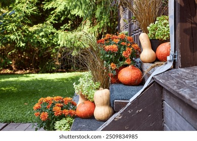 Autumn entryway decor, staircase decor with pumpkins and fall flowers - Powered by Shutterstock