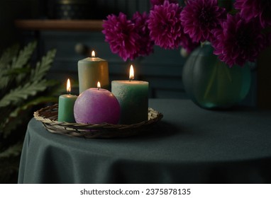 Autumn evening by candlelight. Beautiful Dahlias on the table, Thanksgiving autumn decor with lit candles at home - Powered by Shutterstock