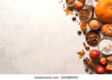 Autumn Fall Baking Food Background With Pumpkins, Apples, Nuts And Seasonal Spices On White. Cooking Pumpkin Or Apple Pie And Cookies For Thanksgiving And Autumn Holidays.