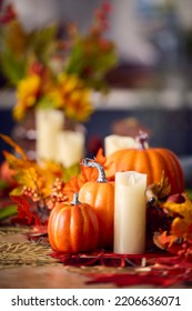 Autumn Or Fall Table Decoration At Home With Pumpkins Candle And Leaves