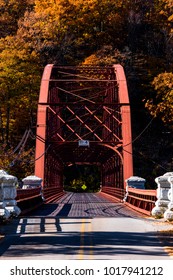 An Autumn / Fall View Of The Red Hued Steel Truss Gate House Bridge Over The New Croton Reservoir In Westchester County, New York.