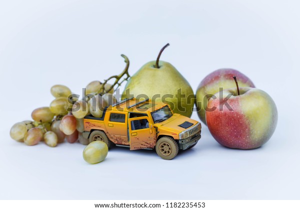 Autumn farm pickup car and fruit harvest apples,\
pear and grapes