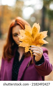 Autumn Fashion, Earth Tones Style, Bright Fall Color Palette. Portrait Of Red-haired Girl In Purple Coat