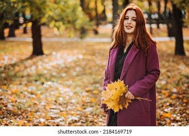 Autumn Fashion, Earth Tones Style, Bright Fall Color Palette. Portrait Of Red-haired Girl In Purple Coat