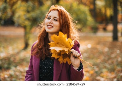 Autumn Fashion, Earth Tones Style, Bright Fall Color Palette. Portrait Of Red-haired Girl In Purple Coat