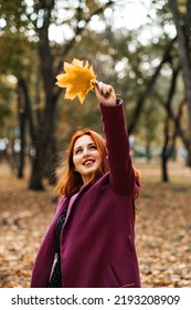 Autumn Fashion, Earth Tones Style, Bright Fall Color Palette. Portrait Of Red-haired Girl In Purple Coat