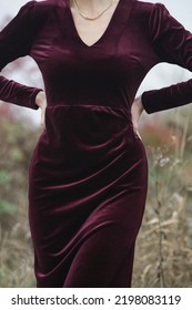 Autumn Fashion Outdoor Portrait Of Young Woman In Purple Red Plush Velvet Midi Dress. 