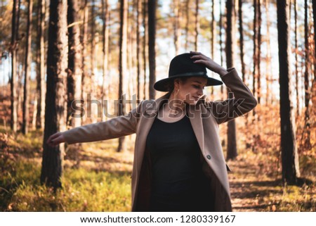 Similar – Image, Stock Photo Blonde woman portrait with the hands in her hat, discovering the forest.