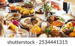 Autumn festive table with dishes like corn, pumpkin pie, and vegetables. Diverse people enjoying autumn festival meal with seasonal decorations. Thanksgiving meal with pumpkin pie and seasonal dishes