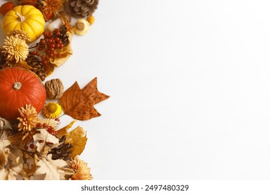 Autumn flat lay. Pumpkins, fall leaves and flowers, berries and pine cones border on white wood background. Autumnal template with space for text. Thanksgiving background - Powered by Shutterstock