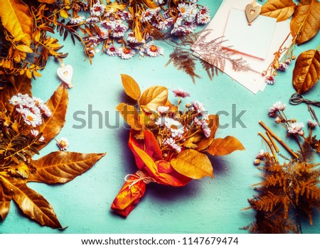 Autumn flowers and leaves decoration with bunch of flowers