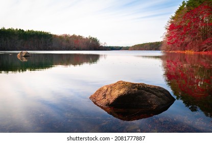 Autumn Foliage, Glacial Rocks, Dramatic Cloudscape, Mirror-like Reflections On The Calm Water.