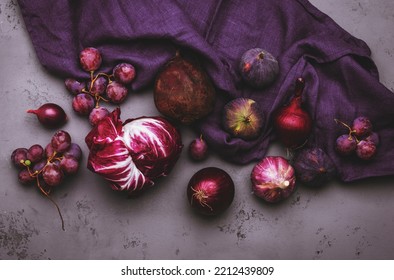 Autumn Food Background With Purple Vegetables, Roots And Fruits:: Radicchio, Beetroot, Red Onion, Grapes, Figs. Harvesting, Local Farm Market Shopping, Healthy Food Concept. Top View