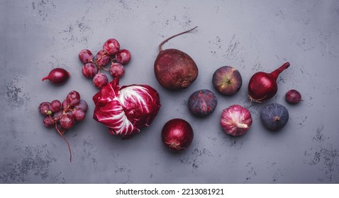 Autumn Food Background With Purple Vegetables, Roots And Fruits:: Radicchio, Beetroot, Red Onion, Grapes, Figs. Harvesting, Local Farm Market Shopping, Healthy Food Concept. Top View