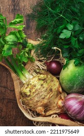 Autumn Food Background With Vegetables, Root Crops In String Bag: Celery, Radish, Parsnips, Carrots. Harvesting, Local Farm Market Shopping, Healthy Eating Concept. Rustic Wood Table. Top View