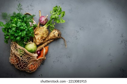 Autumn Food Background With Vegetables, Root Crops In String Bag: Celery, Radish, Parsnips, Carrots. Harvesting, Local Farm Market Shopping, Healthy Eating Concept. Top View Banner