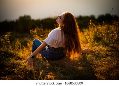 Two Young Women Sitting On Grass Stock Photo (Edit Now) 146837942