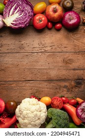 Autumn Harvest, Fruits And Vegetables. Copy Space Concept Vertical Frame On A Wooden Table Flatlay Top View