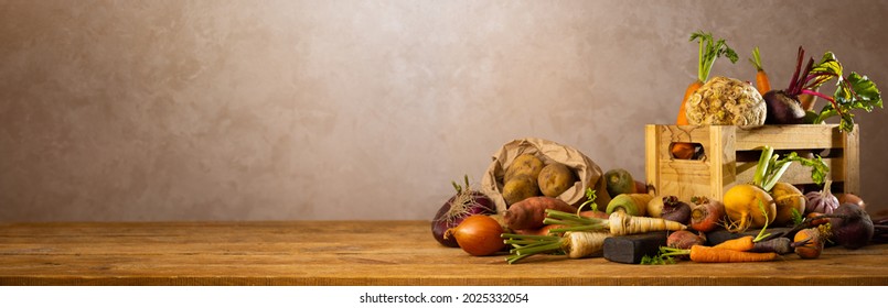 Autumn Harvest Of Root Vegetables. Still Life Of Food On Wooden Table. Concept Healthy Food. Banner.