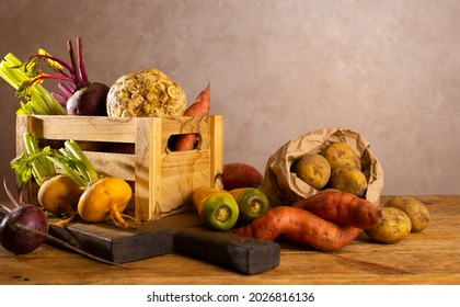 Autumn Harvest Of Root Vegetables. Still Life Of Food On Wooden Table. Concept Healthy Food.