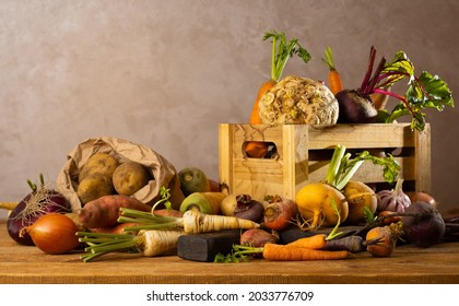 Autumn Harvest Of Root Vegetables. Still Life Of Food On Wooden Table. Concept Healthy Food.