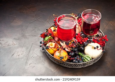 Autumn Healthy Beverages Concept. Cup Of Tea With Autumn Berries, Viburnum, Wild Grape Leaves