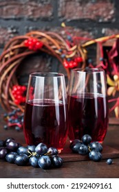 Autumn Healthy Beverages Concept. Cup Of Tea With Autumn Berries, Viburnum, Wild Grape Leaves