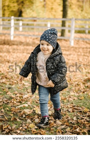 Similar – Image, Stock Photo Cute baby seeing falling leaves