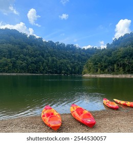 Autumn lake scenery with mountains, lake, and kayaks. Travel and outdoor adventure closeup. Panoramic river water and trees background. - Powered by Shutterstock