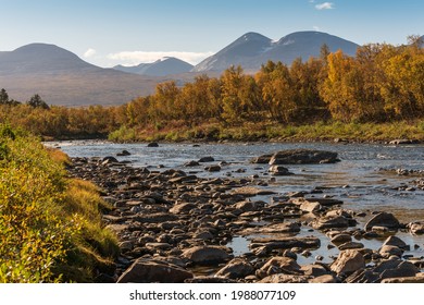 Autumn landscape with Abisko river and mountains. Northern Sweden